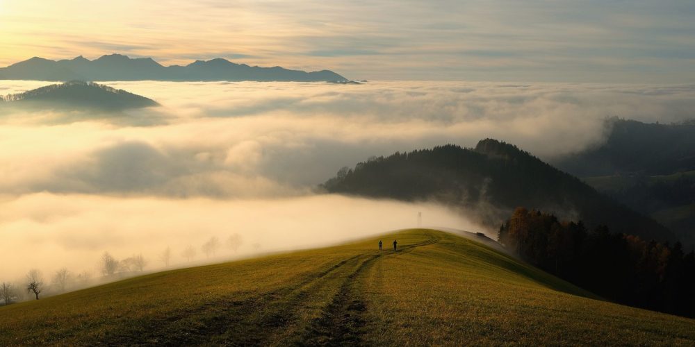 mountains, fog, sky, clouds, sea of clouds, hills, mountain range, grass, grassy, path, trail, mountain path, mountain trail, nature trail, nature path, people, silhouettes, horizon, mountain landscape, landscape, nature, foggy, morning fog, haze, mist, path, path, path, path, path, trail, mountain path, people